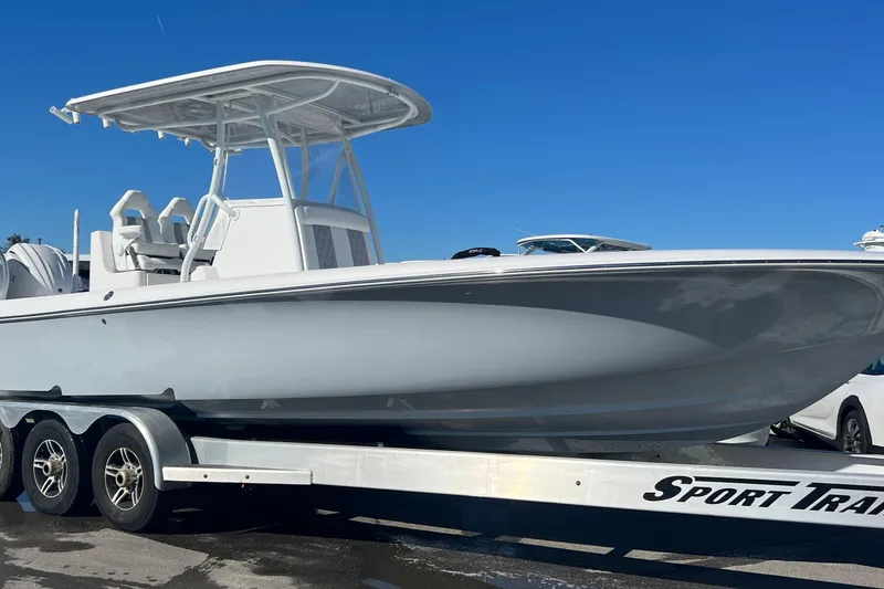 Slide: The Image of 2026 Contender 29 Bay boat with twin Yamaha V6 engines on a trailer. - 4