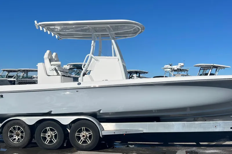Slide: The Image of 2026 Contender 29 Bay boat with dual 300 V6 outboard engines, rear view. - 5