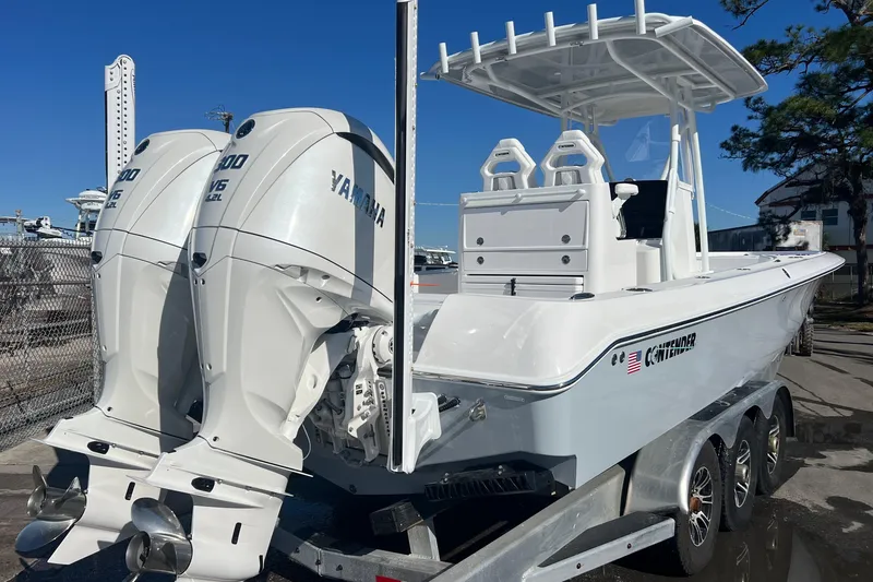 Slide: The Image of 2026 Contender 29 Bay boat interior with seating and storage compartments. - 7