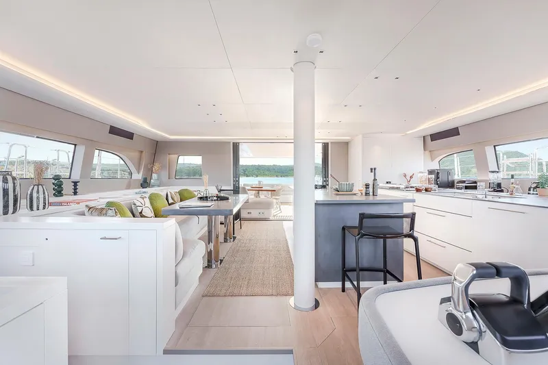 Slide: The Image of Luxurious interior of 2025 Lagoon SIXTY 5 yacht with modern furnishings and panoramic windows. - 12