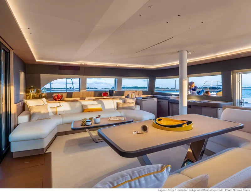 Slide: The Image of Luxurious interior of 2025 Lagoon SIXTY 5 yacht with modern furnishings and panoramic windows. - 19