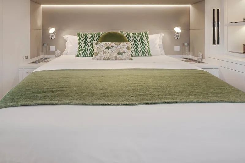 Slide: The Image of Luxurious bedroom interior of 2025 Lagoon SIXTY 5 yacht with green accents. - 22