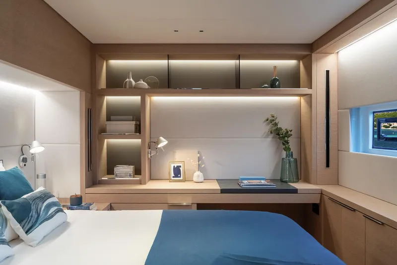 Slide: The Image of Luxurious interior of 2025 Lagoon SIXTY 5 yacht cabin with modern decor and ambient lighting. - 30