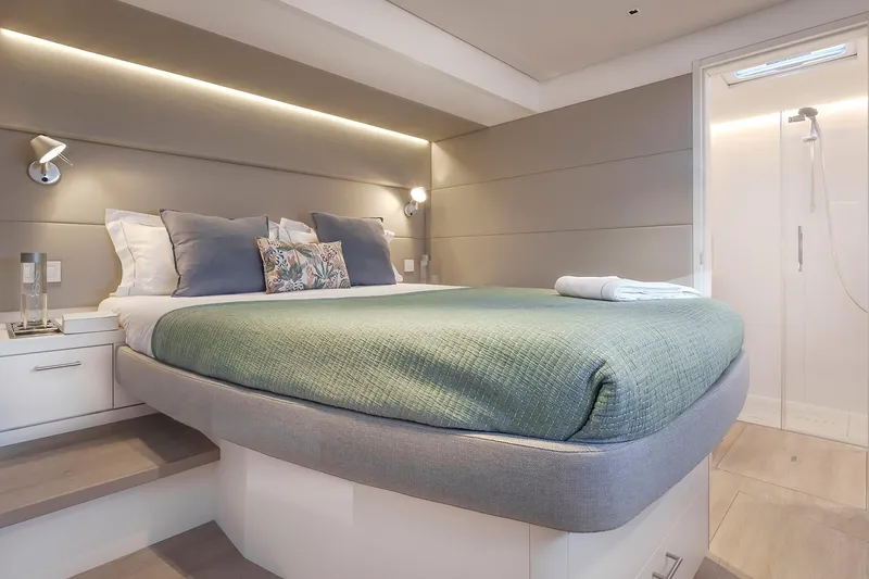 Slide: The Image of Luxurious bedroom interior of 2025 Lagoon SIXTY 5 yacht with modern design and cozy bedding. - 34