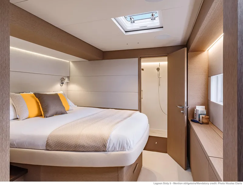 Slide: The Image of Luxurious bedroom interior of 2025 Lagoon SIXTY 5 yacht with modern design and cozy ambiance. - 47