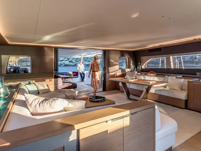 Slide: The Image of Luxurious interior of 2025 Lagoon SIXTY 7 yacht with elegant seating and dining area. - 13