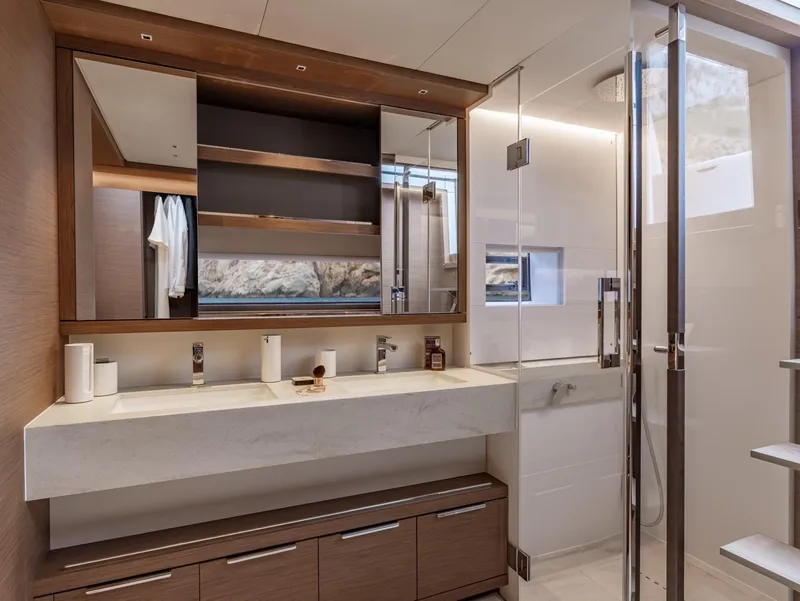 Slide: The Image of Luxurious bathroom interior of 2025 Lagoon SIXTY 7 yacht with modern fixtures and elegant design. - 17