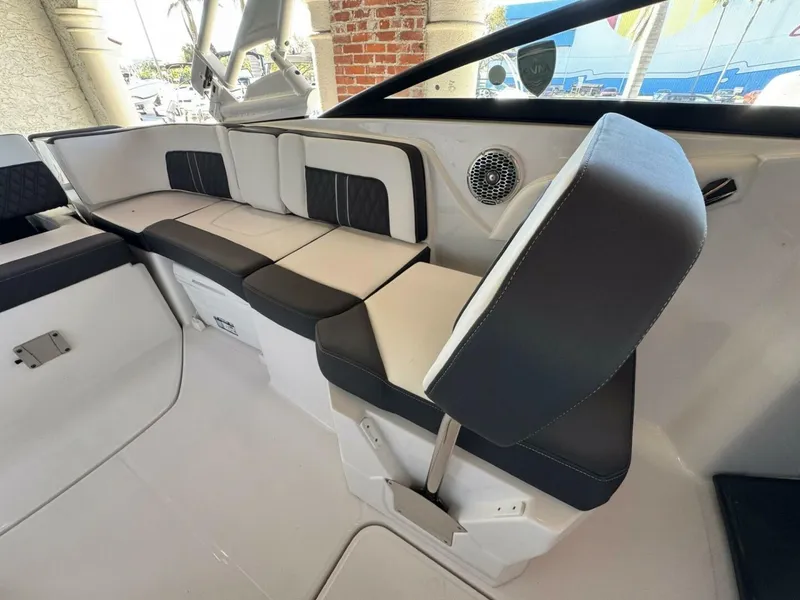 Slide: The Image of 2024 Monterey M-65 boat interior with sleek seating and modern design elements. - 12