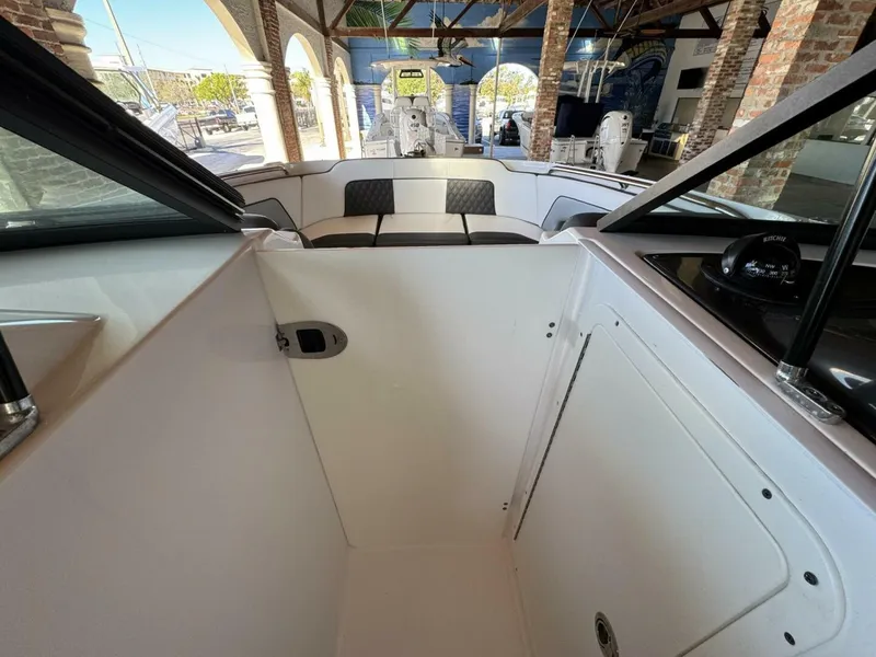 Slide: The Image of 2024 Monterey M-65 boat interior with seating and navigation equipment. - 19