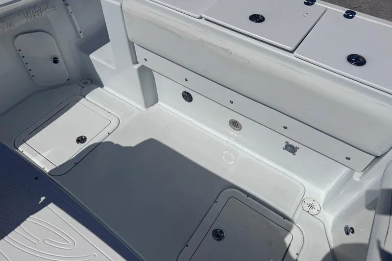 Slide: The Image of 2006 Baja 250 Sportfish boat interior with storage compartments and seating. - 10