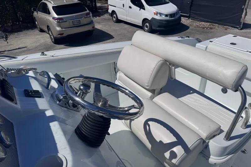 Slide: The Image of 2006 Baja 250 Sportfish boat interior with steering wheel and seating. - 12
