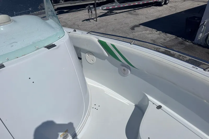Slide: The Image of 2006 Baja 250 Sportfish boat interior with green accents and speaker. - 14