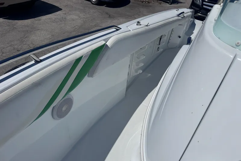 Slide: The Image of 2006 Baja 250 Sportfish boat interior with green accents and speaker detail. - 15