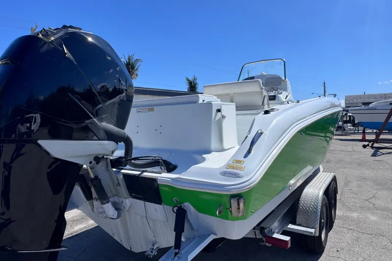 Slide: The Image of 2006 Baja 250 Sportfish boat with green and white hull on a trailer. - 6