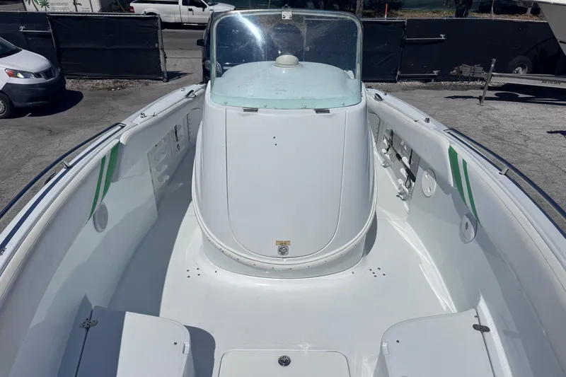 Slide: The Image of 2006 Baja 250 Sportfish boat, white interior, docked outdoors. - 8