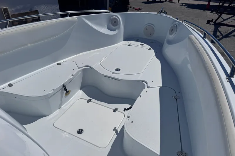 Slide: The Image of 2006 Baja 250 Sportfish boat interior with storage compartments and seating area. - 9