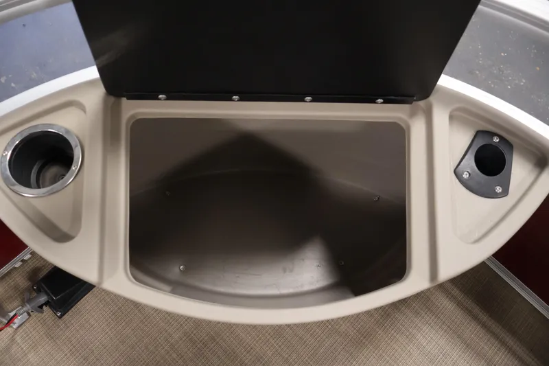 Slide: The Image of 2021 Sun Tracker Bass Buggy 18 DLX storage compartment with cup holders and utility space. - 17