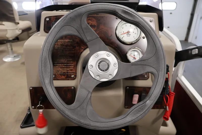 Slide: The Image of Steering wheel and dashboard of 2021 Sun Tracker Bass Buggy 18 DLX boat. - 25