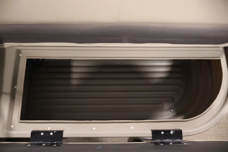 Slide: The Image of Storage compartment of 2021 Sun Tracker Bass Buggy 18 DLX boat, open and empty. - 34