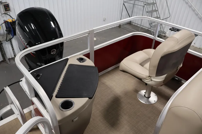 Slide: The Image of 2021 Sun Tracker Bass Buggy 18 DLX interior with seating and Mercury outboard motor. - 36