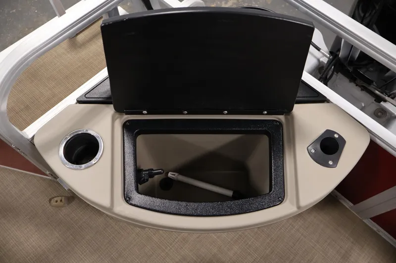 Slide: The Image of 2021 Sun Tracker Bass Buggy 18 DLX storage compartment with cup holder and rod holder. - 38