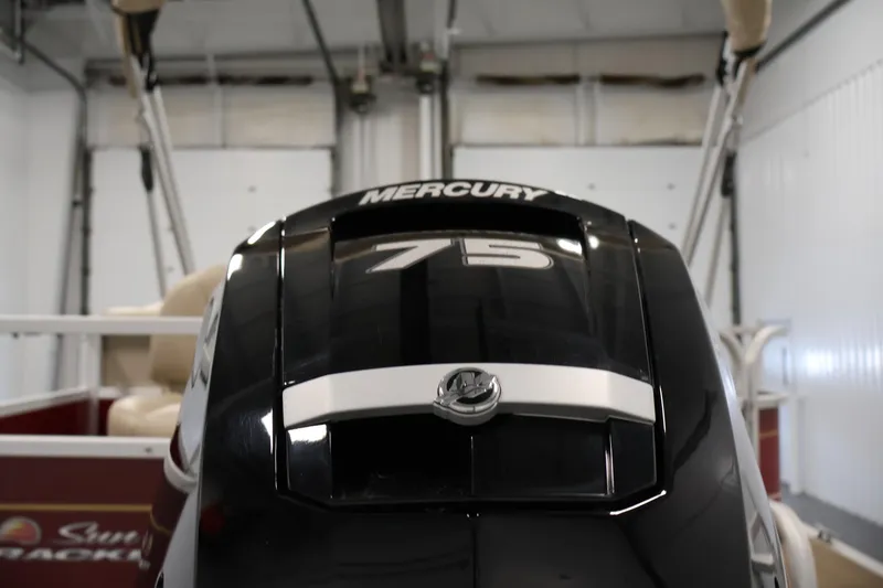 Slide: The Image of 2021 Sun Tracker Bass Buggy 18 DLX with Mercury 75 engine in a garage. - 44