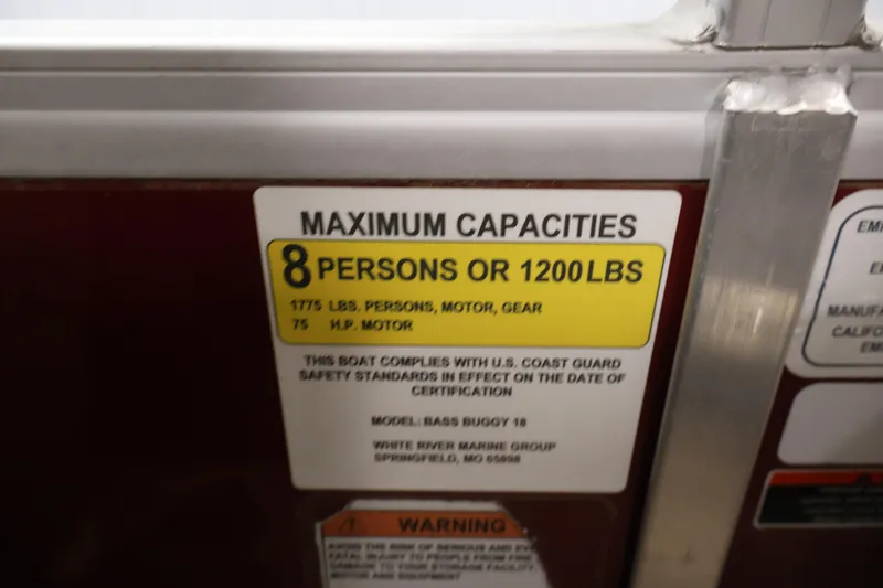 Slide: The Image of 2021 Sun Tracker Bass Buggy 18 DLX capacity label, 8 persons or 1200 lbs limit. - 49