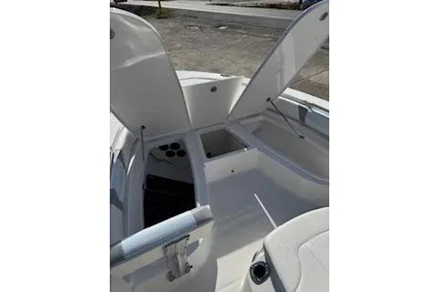 Slide: The Image of 2026 Robalo 206 Cayman boat interior with open storage compartments and seating. - 10