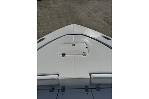 Slide: The Image of 2026 Robalo 206 Cayman boat deck with storage compartment, viewed from above. - 11