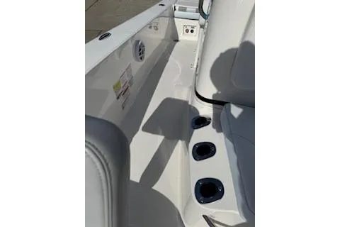 Slide: The Image of 2026 Robalo 206 Cayman boat interior with cup holders and seating area. - 16