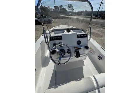 Slide: The Image of 2026 Robalo 206 Cayman boat dashboard with steering wheel and controls. - 18