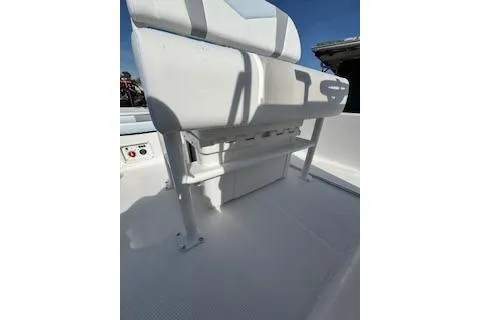 Slide: The Image of 2026 Robalo 206 Cayman boat interior with white seating and storage. - 21