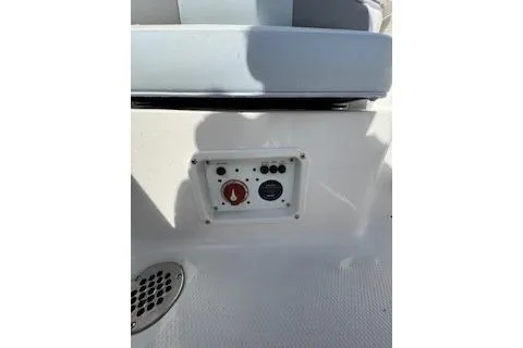 Slide: The Image of 2026 Robalo 206 Cayman boat control panel with seating in background. - 22