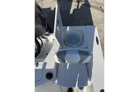 Slide: The Image of 2026 Robalo 206 Cayman boat interior with seating and storage compartment. - 25