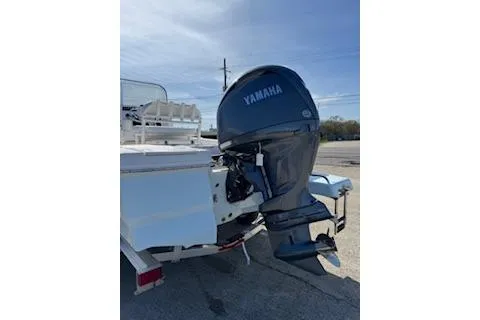 Slide: The Image of 2026 Robalo 206 Cayman boat with Yamaha outboard motor on a trailer. - 4