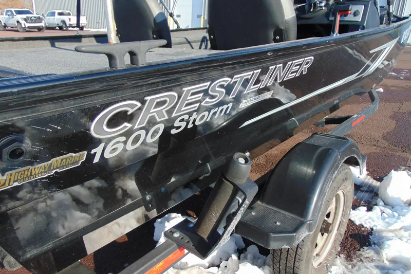 Slide: The Image of 2020 Crestliner 1600 Storm boat on trailer, parked on snowy ground. - 12