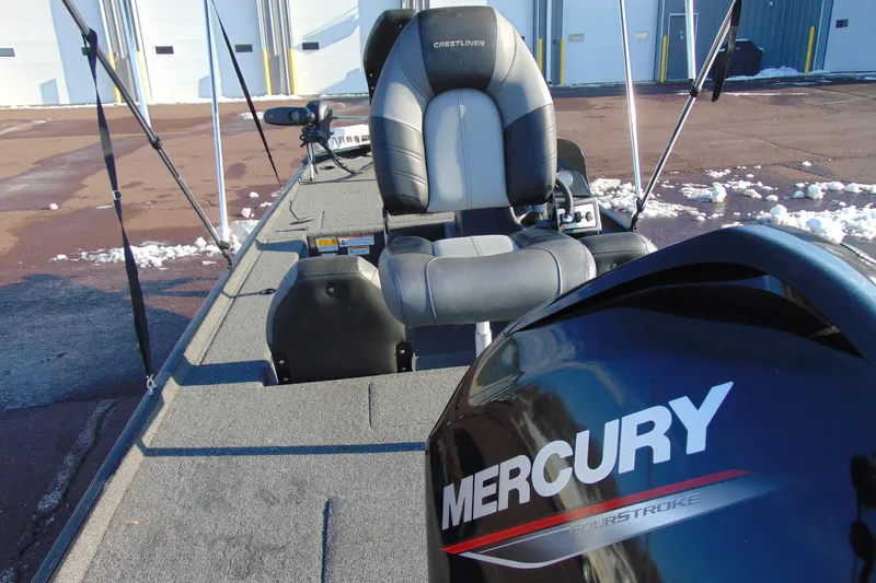 Slide: The Image of 2020 Crestliner 1600 Storm boat with Mercury FourStroke engine, parked on snowy pavement. - 14