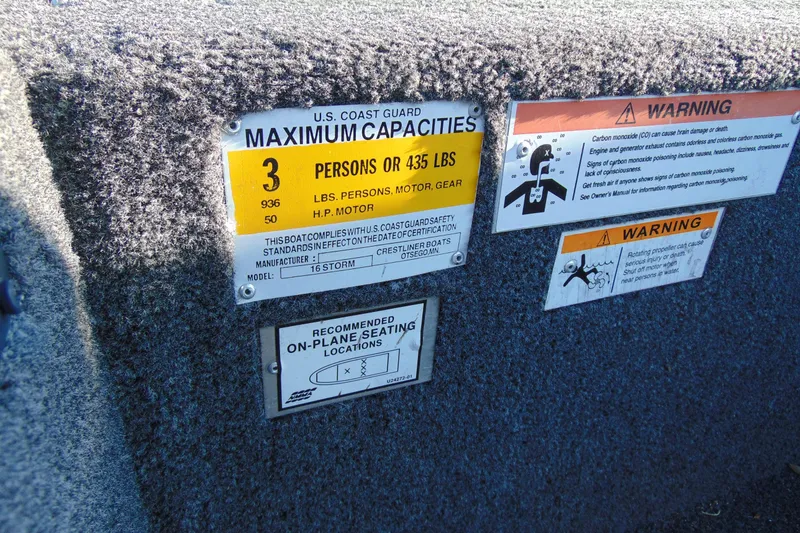 Slide: The Image of 2020 Crestliner 1600 Storm boat capacity and safety warning labels. - 15