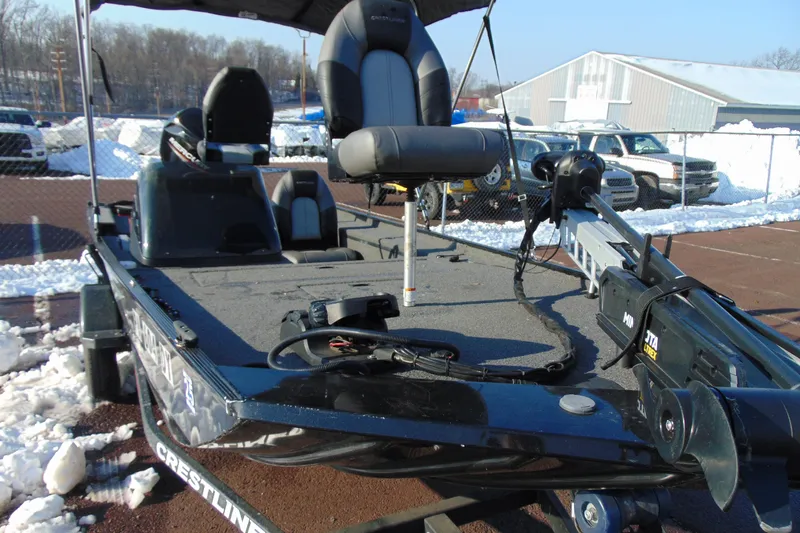 Slide: The Image of 2020 Crestliner 1600 Storm fishing boat with seating and equipment, parked in snowy lot. - 9