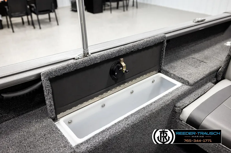 Slide: The Image of 2023 Lund 1875 Impact XS boat interior with storage compartment and seating. - 26