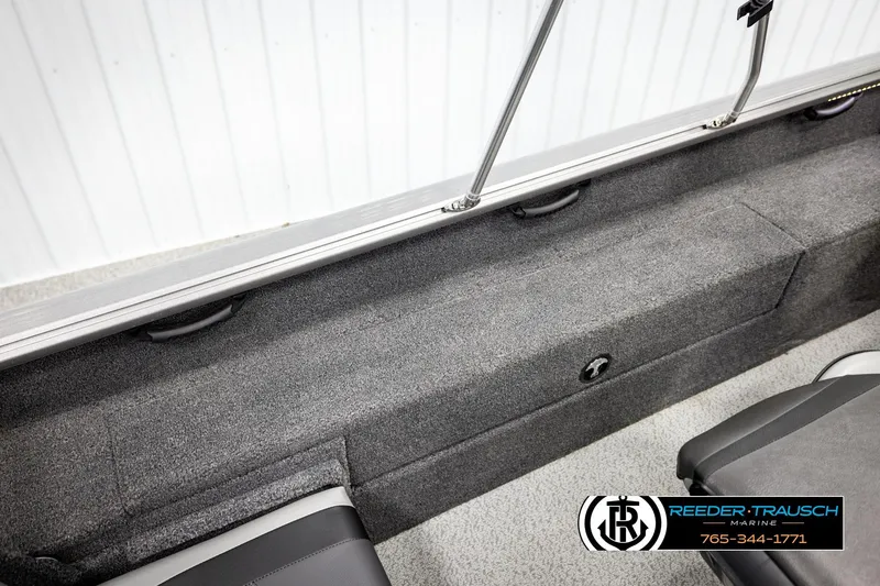 Slide: The Image of 2023 Lund 1875 Impact XS boat interior with gray carpet and seating. - 27