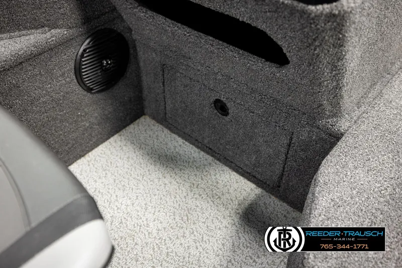Slide: The Image of 2023 Lund 1875 Impact XS interior with speaker and storage compartment. - 29