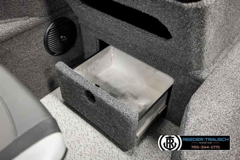 Slide: The Image of 2023 Lund 1875 Impact XS boat interior storage compartment with speaker detail. - 30