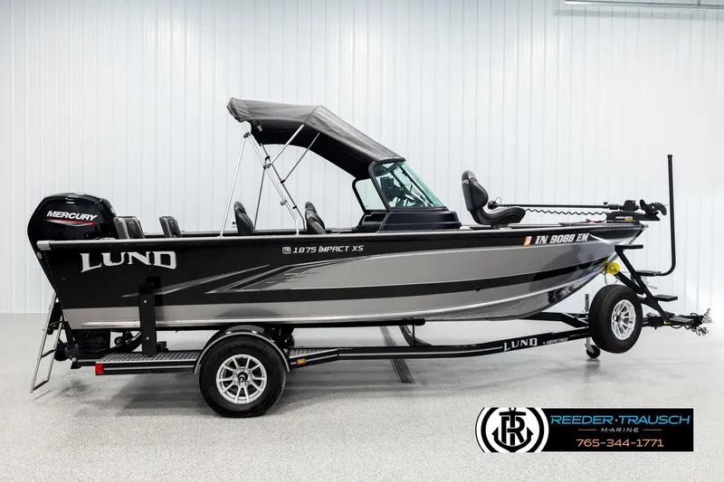 Slide: The Image of 2023 Lund 1875 Impact XS fishing boat with Mercury engine on trailer. - 4