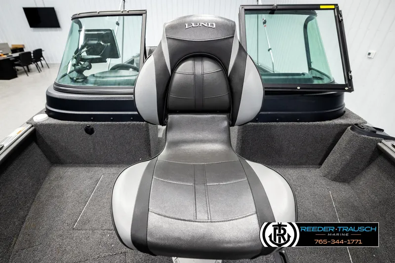 Slide: The Image of 2023 Lund 1875 Impact XS boat interior with a comfortable captain's chair. - 41