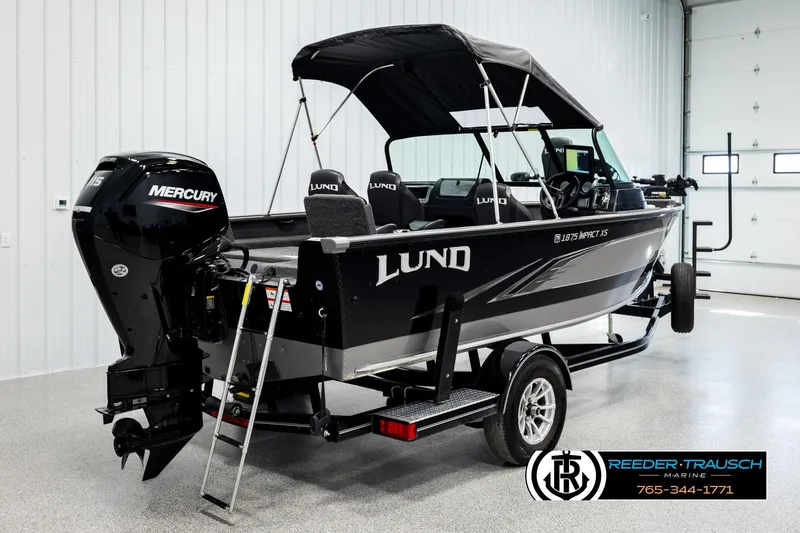 Slide: The Image of 2023 Lund 1875 Impact XS boat with Mercury engine in showroom. - 5