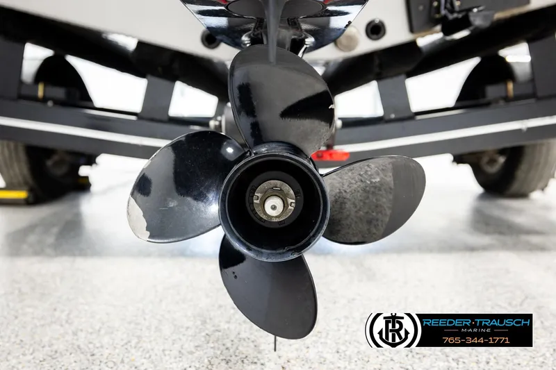 Slide: The Image of Close-up of a 2023 Lund 1875 Impact XS boat propeller in a showroom. - 52