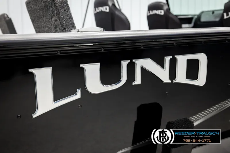 Slide: The Image of 2023 Lund 1875 Impact XS boat with prominent logo and sleek design. - 58
