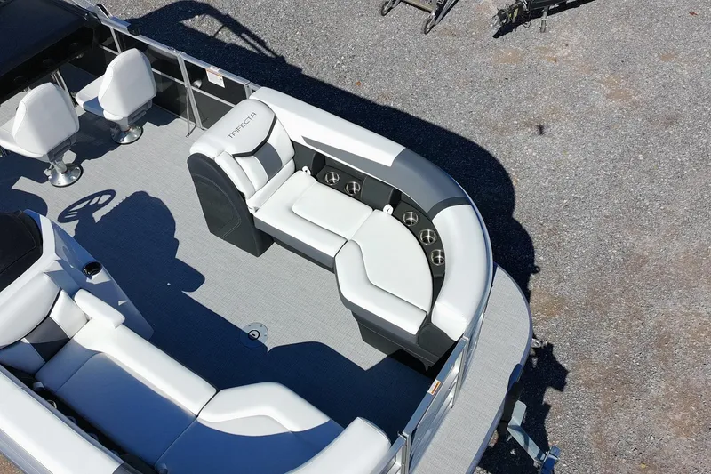 Slide: The Image of 2026 Trifecta 24E CS pontoon boat interior with plush seating and modern design. - 12