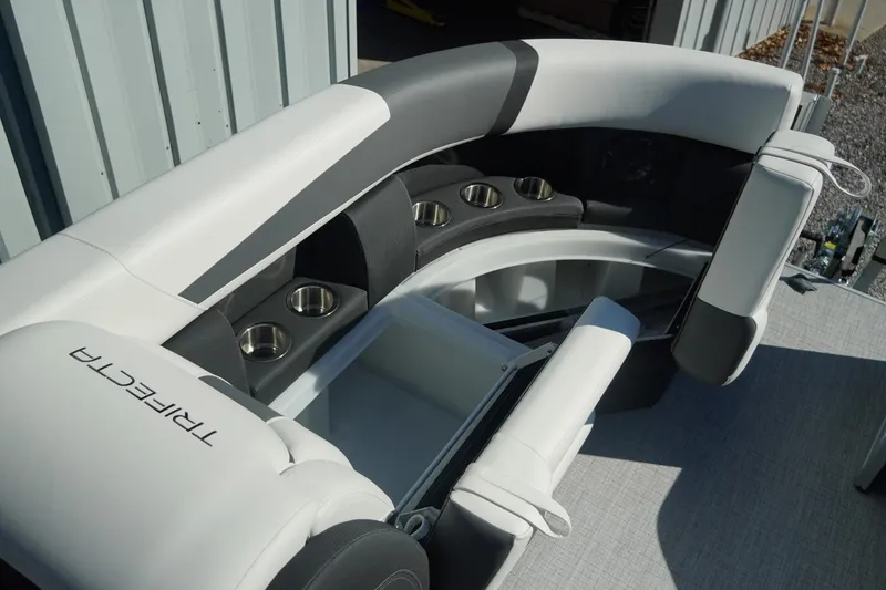 Slide: The Image of Luxurious seating on 2026 Trifecta 24E CS boat with cup holders and storage. - 13